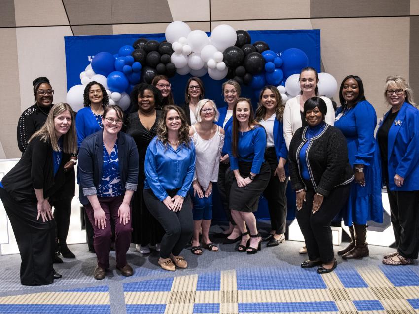 Sarah Bennett Holmes Award Event, UKWF board members standing by balloon background